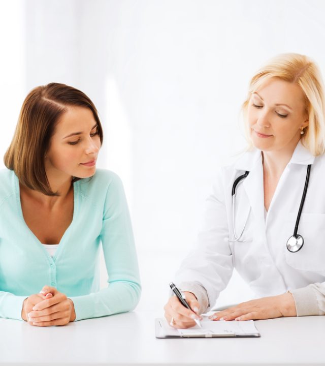 doctor with patient in hospital healthcare and medical concept - doctor with patient in hospital